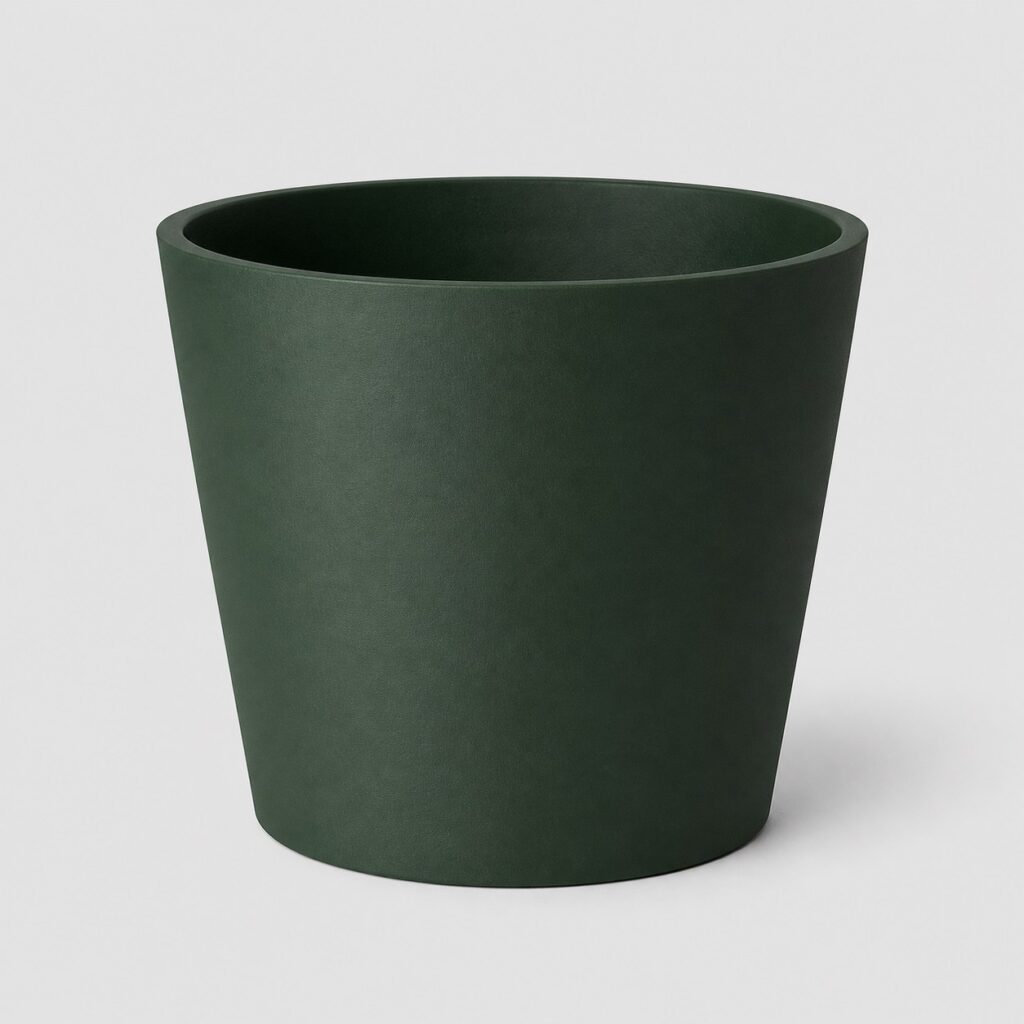 Grand pot de fleur rond en résine verte sur fond gris clair