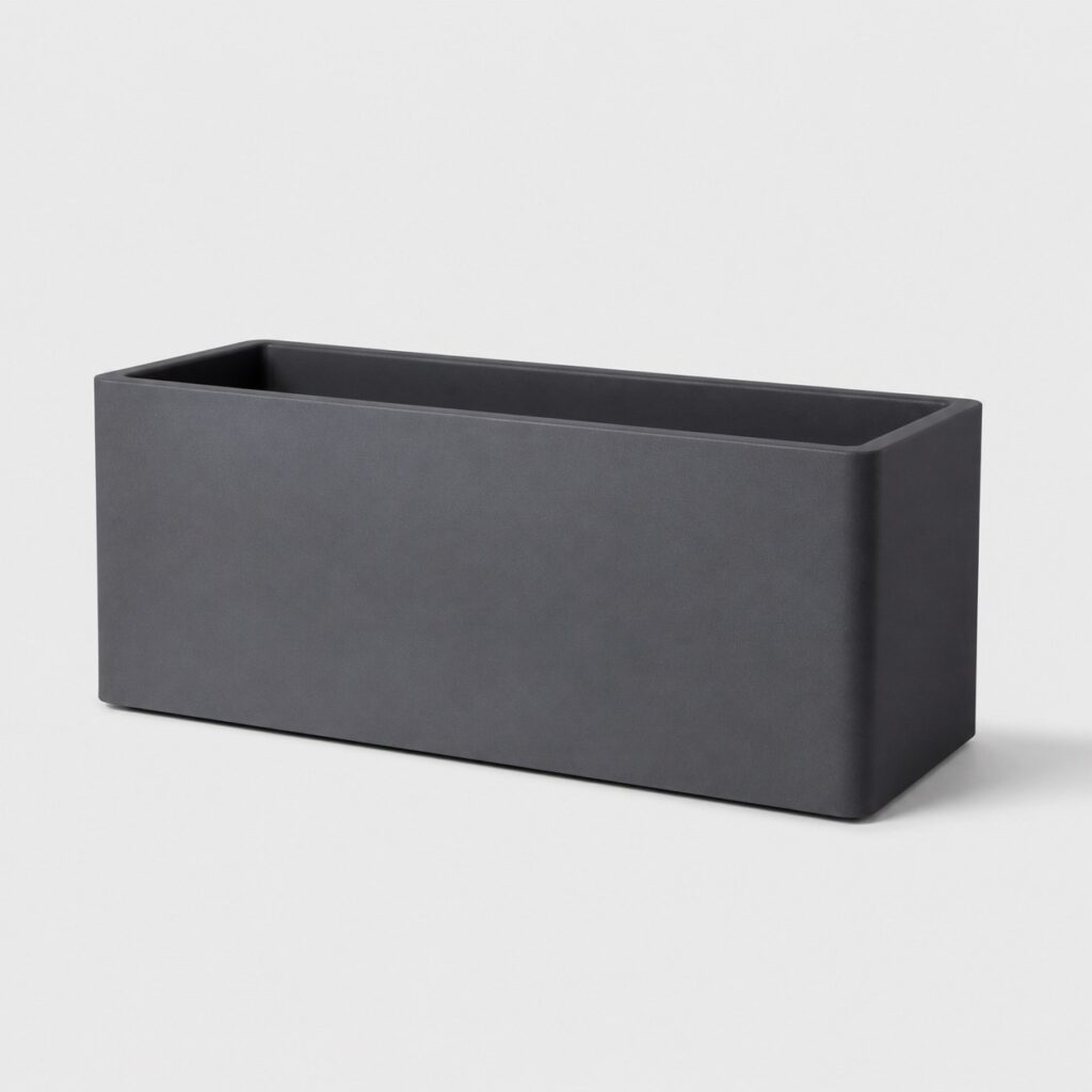 Jardinière rectangulaire en résine anthracite sur fond gris clair